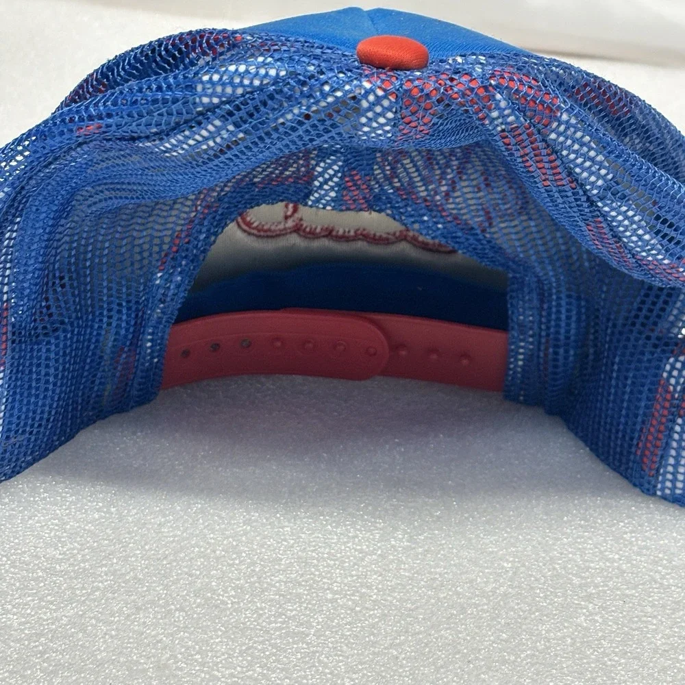 RVCA foam trucker hat featuring a blue crown, red brim, and red mesh back